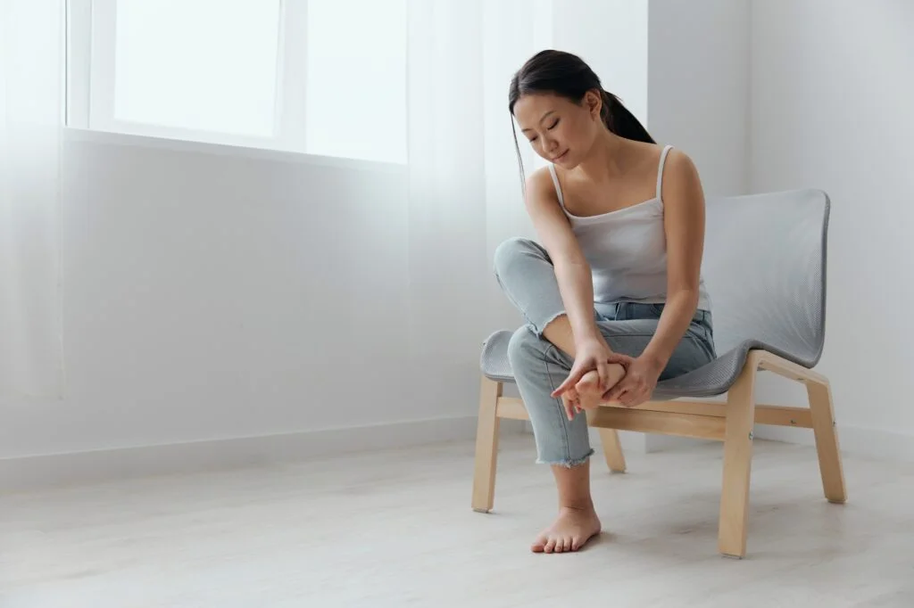 Woman holding her foot